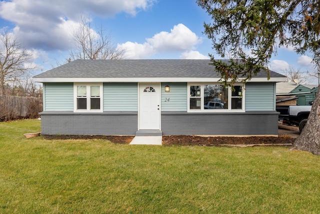 ranch-style house featuring a front lawn