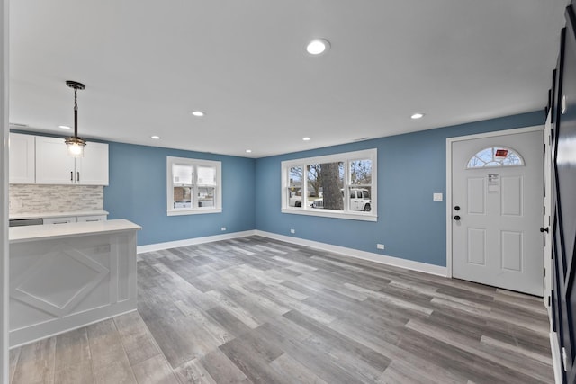 unfurnished living room featuring light hardwood / wood-style floors