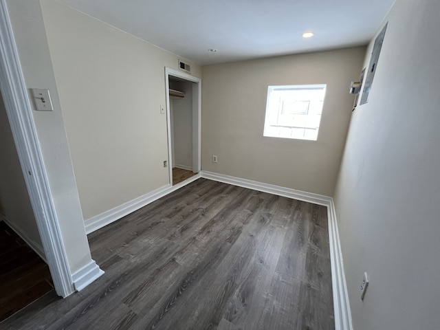 unfurnished bedroom with dark hardwood / wood-style floors