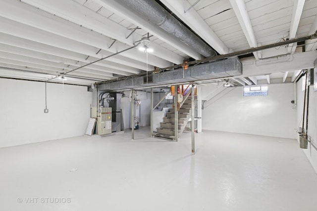 basement featuring heating unit and gas water heater