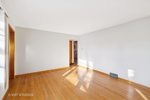 empty room with light wood-type flooring