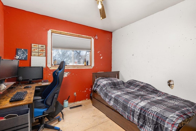 bedroom with ceiling fan and concrete floors