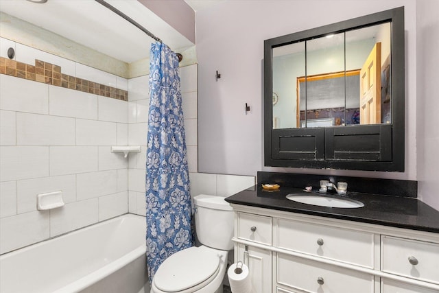 full bathroom with shower / bath combo, toilet, and vanity