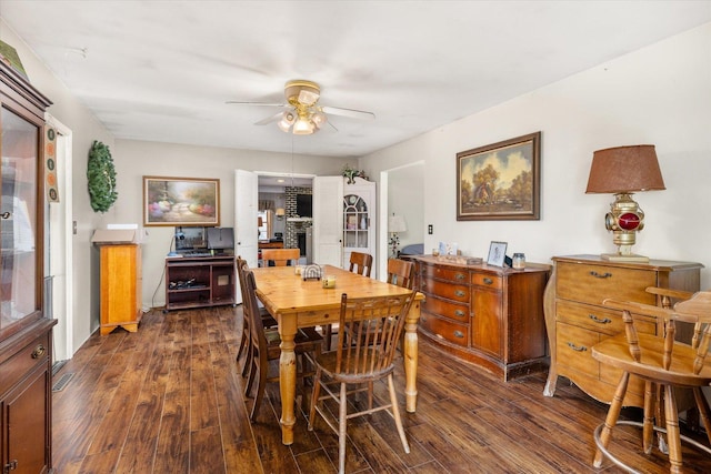 dining area with dark hardwood / wood-style flooring and ceiling fan