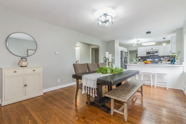 dining space featuring hardwood / wood-style floors