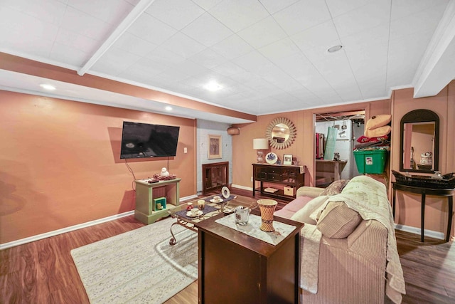 living room with hardwood / wood-style floors and crown molding