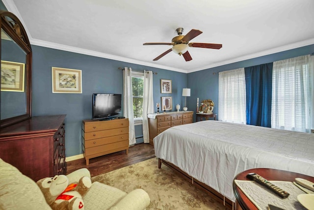 bedroom with wood-type flooring, ceiling fan, and crown molding