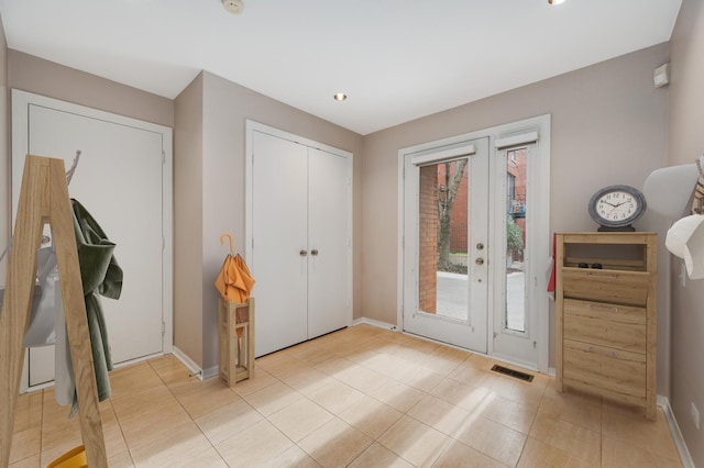 doorway to outside featuring light tile patterned floors