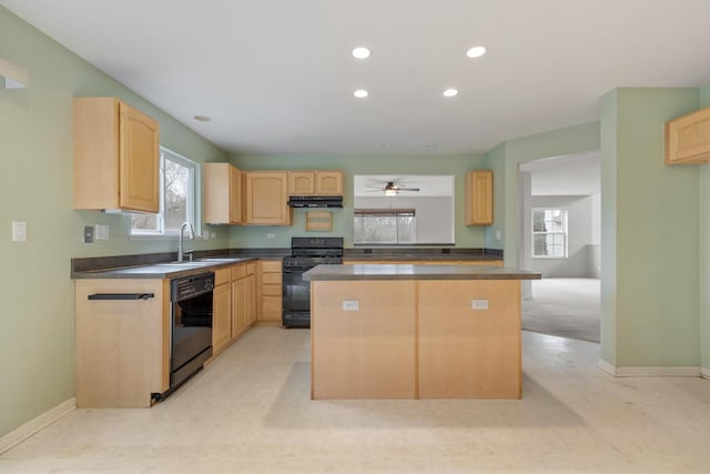 kitchen featuring black appliances, a center island, sink, and light brown cabinetry