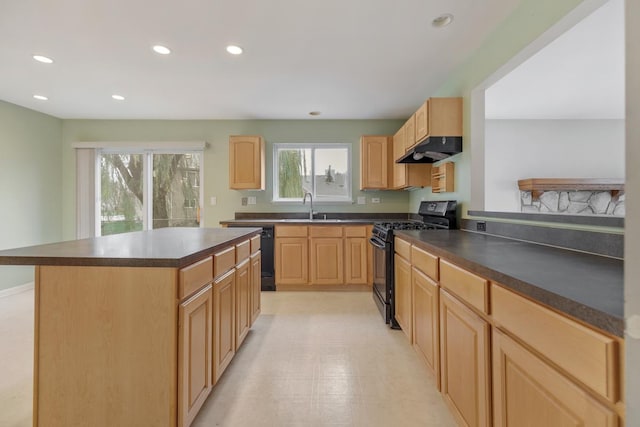 kitchen with sink, a center island, black appliances, and light brown cabinets