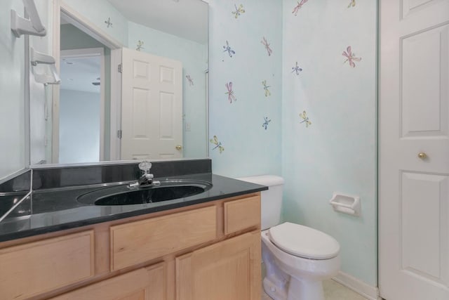 bathroom with vanity and toilet