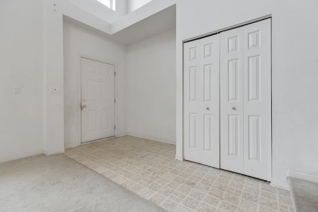 view of carpeted entrance foyer