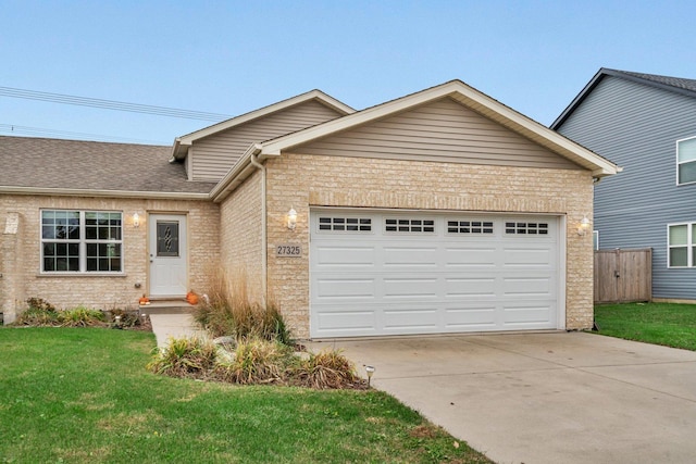 view of front of home featuring a garage and a front yard