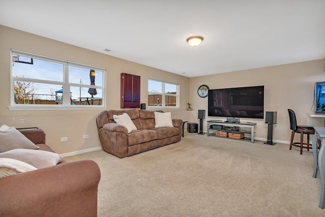 living room featuring light carpet