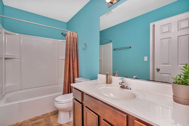 full bathroom with vanity, shower / tub combo, and toilet