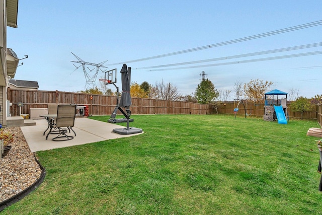 view of yard with a playground and a patio