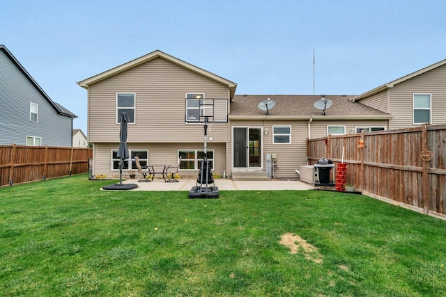 rear view of property featuring a lawn and a patio area