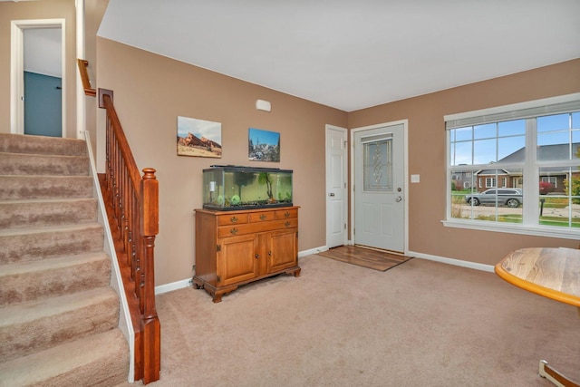 view of carpeted foyer