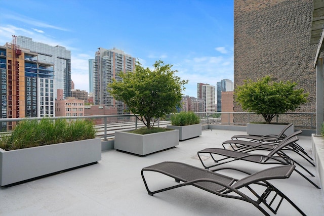 view of patio featuring a balcony