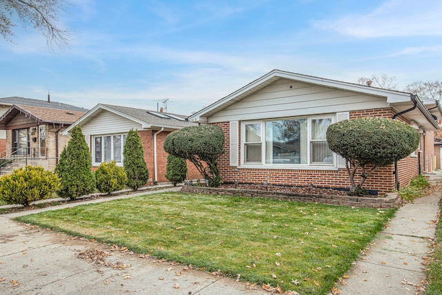 bungalow-style house with a front yard