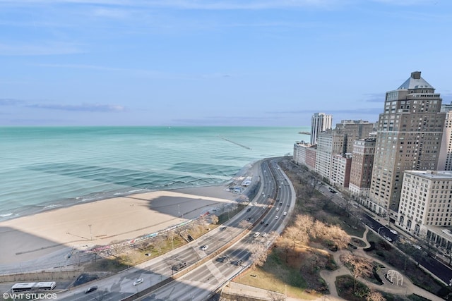 bird's eye view with a water view and a view of the beach