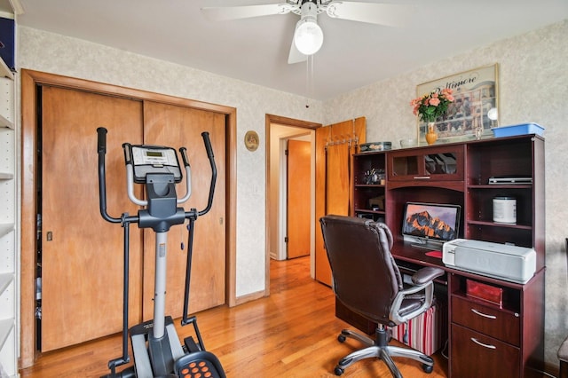 home office featuring light hardwood / wood-style floors and ceiling fan