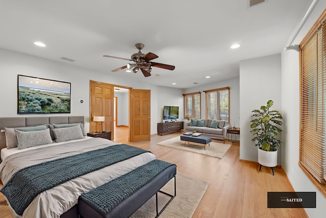 bedroom featuring recessed lighting, visible vents, ceiling fan, light wood-type flooring, and baseboards