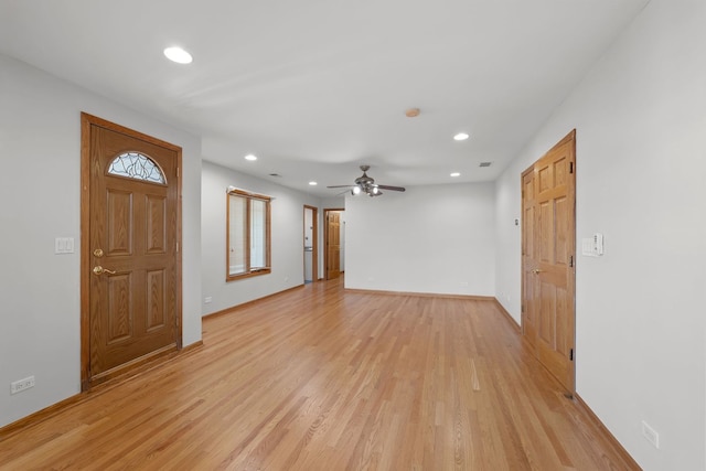 foyer entrance featuring light wood-style floors, recessed lighting, and baseboards