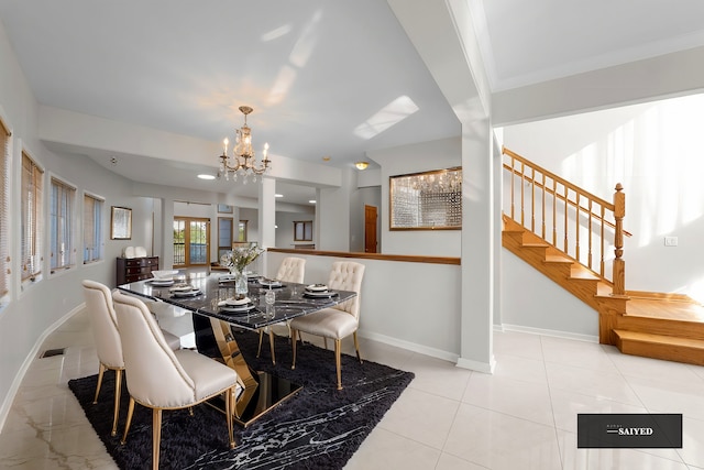 dining space with light tile patterned flooring, a notable chandelier, visible vents, baseboards, and stairs