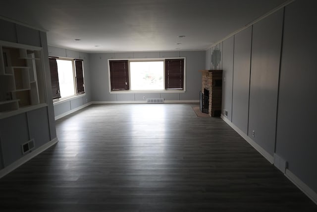 unfurnished living room featuring dark hardwood / wood-style flooring