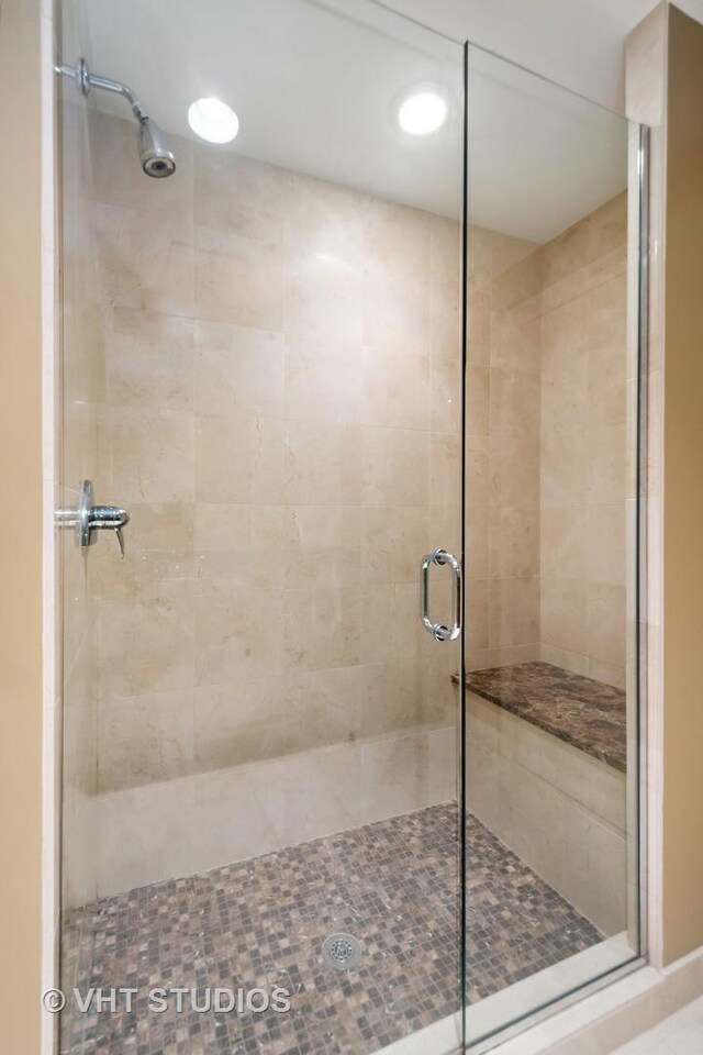 bathroom with a shower with shower door