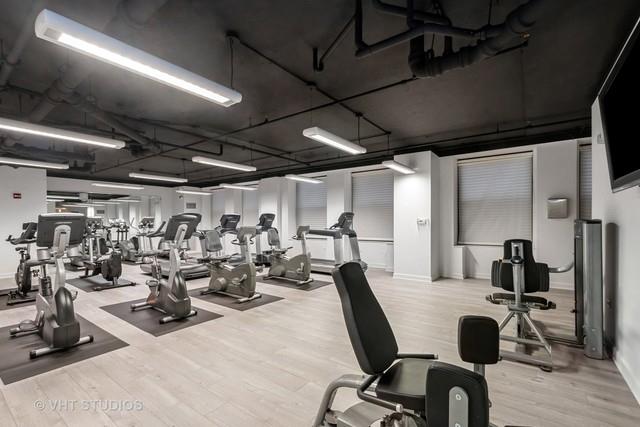 workout area featuring light wood-type flooring