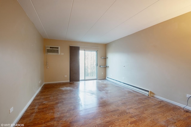 empty room featuring a wall mounted AC, wood-type flooring, and a baseboard heating unit