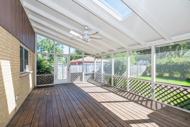 unfurnished sunroom with vaulted ceiling with beams and ceiling fan