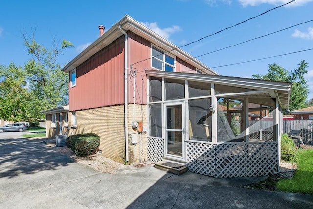 view of home's exterior featuring a sunroom