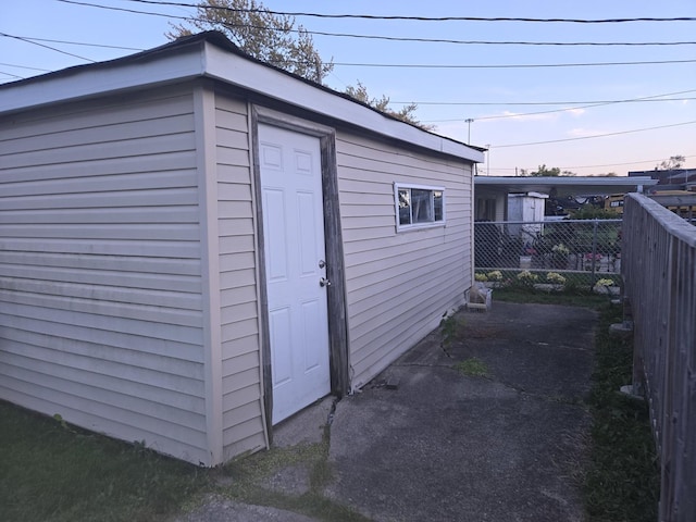 view of outdoor structure at dusk