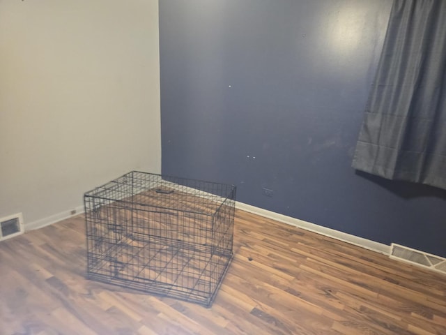 bedroom with wood-type flooring