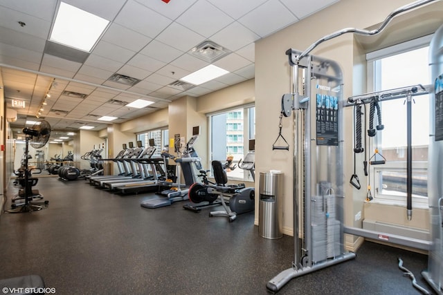 gym featuring a drop ceiling