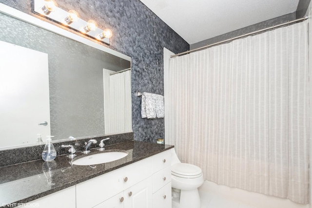 bathroom featuring tile patterned floors, vanity, a shower with shower curtain, and toilet