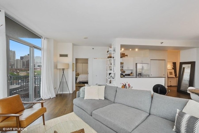 living room with dark hardwood / wood-style floors