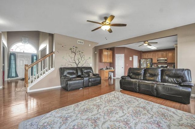 living room with ceiling fan and wood-type flooring