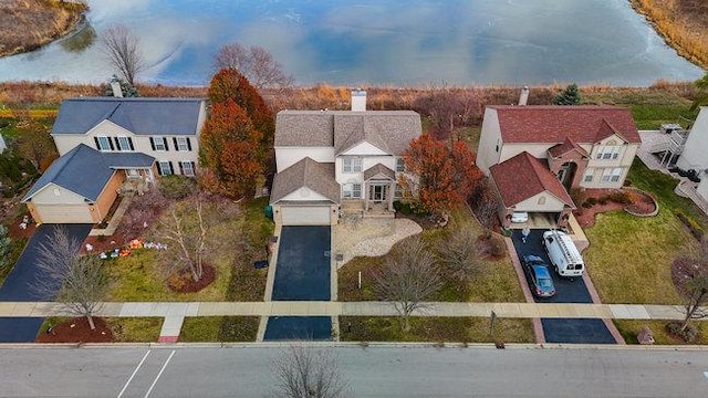 birds eye view of property featuring a water view