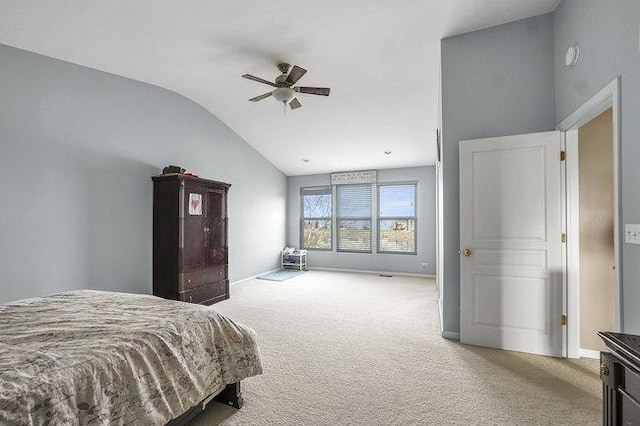 carpeted bedroom with ceiling fan and lofted ceiling