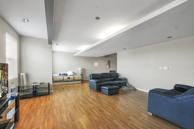 living room with hardwood / wood-style flooring and radiator