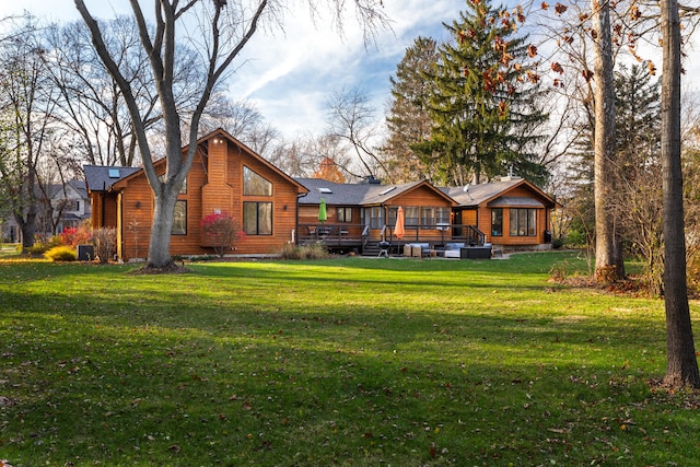 back of property featuring a yard