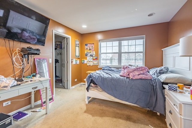 bedroom featuring light carpet