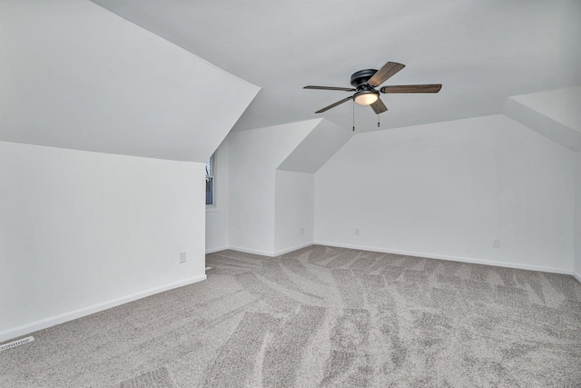 bonus room featuring carpet floors, vaulted ceiling, and ceiling fan