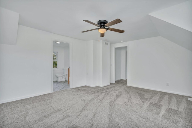 interior space with light colored carpet, vaulted ceiling, and ceiling fan