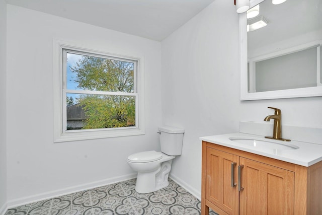 bathroom with tile patterned floors, vanity, and toilet