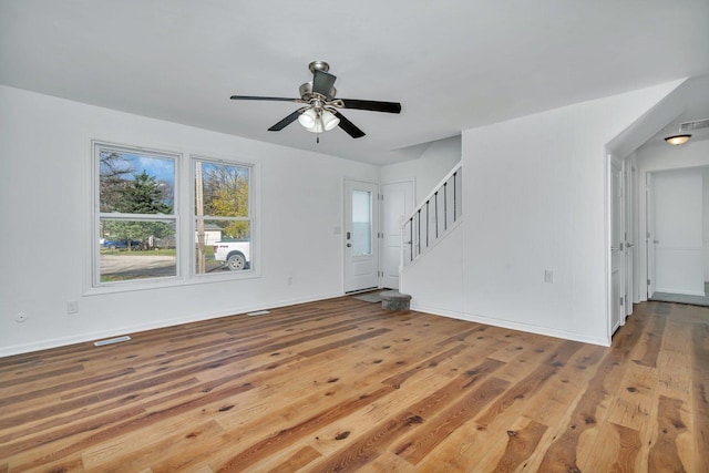 unfurnished living room with ceiling fan and light hardwood / wood-style floors